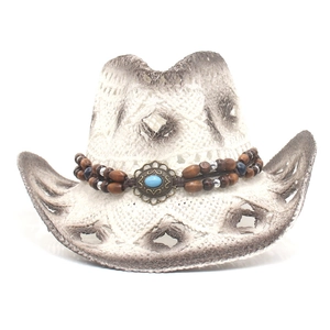 Detail of white straw cowboy hat featuring brown wood beads and turquoise ethnic band