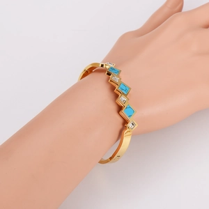 Gouden roestvrijstalen armband met vierkante turkoois en zirkoon in geometrisch ontwerp