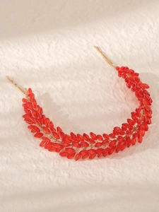 Detailed close-up of red crystal beaded bridal headband with metallic wire handcraft