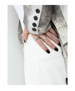 Detail view of S925 silver layered ring and square zircon ring on hand