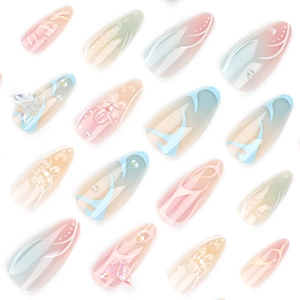 3D butterfly almond press-on nails with floral 3D charms and pastel gradient finish