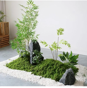 Detailed realistic artificial moss landscape with faux bamboo, black rocks and white gravel