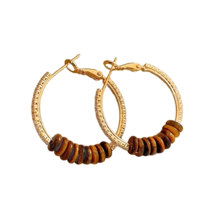 18k gold plated hoop earrings with tiger eye beads and pavé crystals on white background