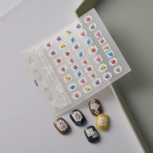 Detailed close-up of 5D white lace and colorful rose embossed nail art stickers TS-060