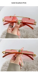 Detail of pink gradient lenses and wood grain temples on square metal pilot sunglasses