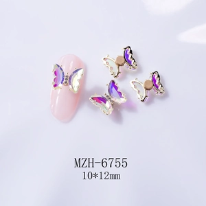 Macro shot of 10x12mm aurora crystal rotating butterfly nail charm with rhinestone edges