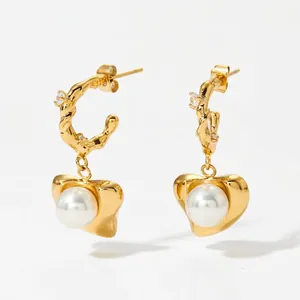 Gold 316 stainless steel heart earrings with twisted hoops and central white pearl inlay