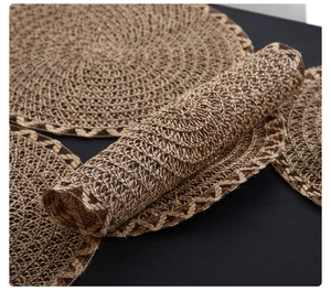 Detailed texture of brown braided round placemats showing soft material and flexibility