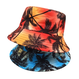 Double-sided bucket hats featuring vibrant tropical sunset and ocean coconut tree patterns