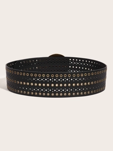 Detail of black PU leather wide belt featuring dense gold metal eyelets and punch designs