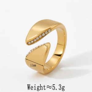 Detailed macro view showing the 11mm wide gold open ring with small inlaid crystals