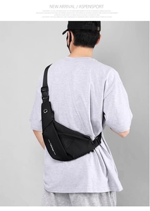 Close-up of waterproof matte black sling bag with earphone port and adjustable buckle