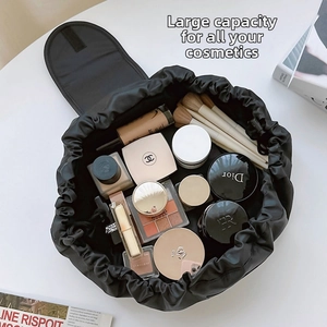 Macro view of a large capacity drawstring makeup bag showing internal storage details