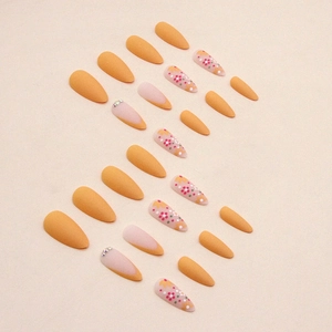 Matte apricot almond press-on nails set with vintage floral patterns and rhinestones