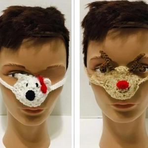 Detail of handmade crochet nose warmers featuring white bear and brown elk designs