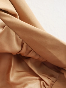Detailed macro view showing the high-density twill fabric and fine stitching on the jacket
