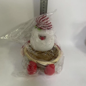 Detail of Christmas plush snowman bamboo candy basket with red striped hat and boots