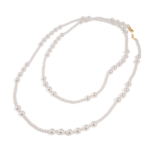 Double-layered stainless steel necklace featuring lustrous white pearls and golden clasp