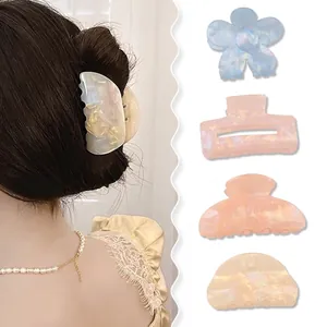 Elegant acetate hair claw set with iridescent finish in floral and geometric shapes