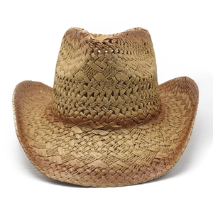 Close-up of retro hollow-weave straw cowboy hat showing intricate texture and curved brim