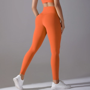 Detailed back view of high-waisted orange yoga pants with seamless push-up lifting effect