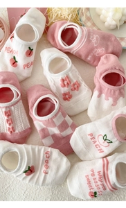 Close-up of pink peach and floral mesh cotton invisible socks with non-slip heels