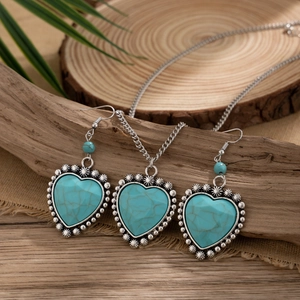 Detailed view of bohemian heart-shaped turquoise necklace and earring jewelry set