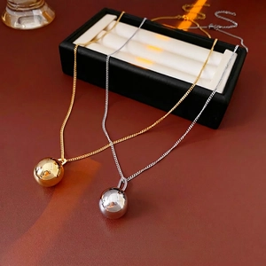 Titanium steel ball pendant necklace set in polished gold and silver metallic finishes