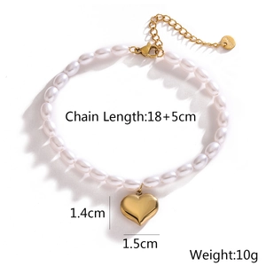 Detail shot of pearl bracelet with 18K gold heart pendant and size specifications