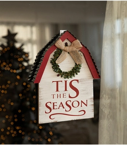Christmas house wall hanging with Tis the Season text on glass background with warm bokeh