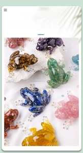 Detailed macro view of crystal stone frog figurines with resin and gold leaf textures