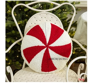 Detailed plush peppermint candy pillow texture on a white decorative chair