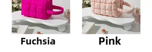 Close-up of quilted makeup bags in magenta and pink showing fabric texture and zippers