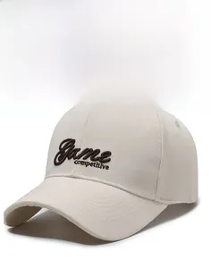 Detail of embroidered 'Game competitive' lettering on a cotton twill baseball cap