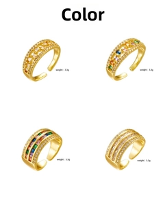 Macro detail of gold plated rings in narrow and wide styles with multi-color zircon inlay
