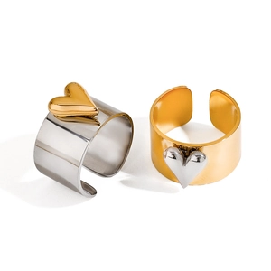 Two-tone heart stainless steel open rings in gold and silver finish on white background