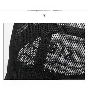 Detailed macro view of black breathable mesh baseball cap with AKUBI embroidered letters