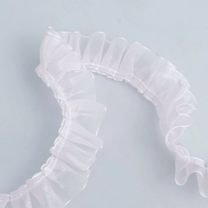 Close-up of 2.5cm white pleated organza lace trim for DIY garment and pet accessory crafts