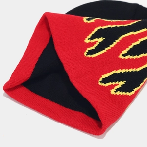 Close-up of knit beanie featuring flame jacquard pattern and detailed ribbed texture