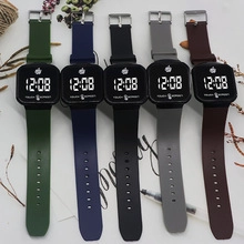 Detailed flat lay of colorful silicone LED touch screen watches in various neutral tones