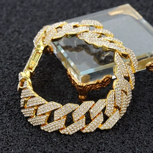 15mm gold-toned Cuban link necklace with rhombic rhinestones on a black background