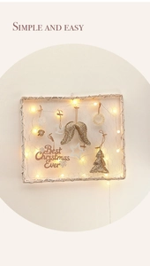 Minimalist DIY Christmas wall decor with LED lights, wings, and a Best Christmas Ever sign