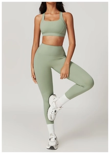 Sage green yoga set with high-waist leggings and wide strap sports bra in matte finish