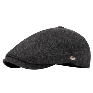 Dark grey wool blend flat cap with textured knit finish and metal side logo