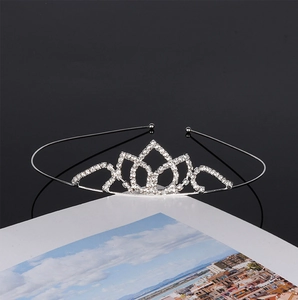 Detailed macro view of silver bridal tiara with sparkling rhinestones and lotus patterns