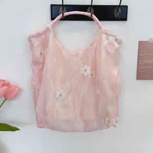 Detail of pink translucent tulle tote with white floral embroidery and round handles
