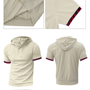 Close-up of waffle knit texture and contrast plaid trim on beige hooded t-shirt set