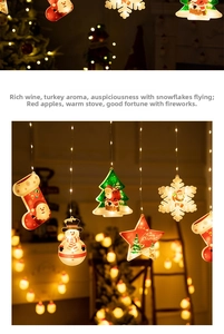Detail of warm white LED Christmas window lights with Santa and snowflake shapes