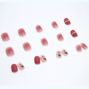 Pink blush press-on nails set with elegant pearl accents and tulip flower designs