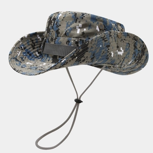 Macro view of digital camouflage sun hat featuring mesh vents and snap buttons